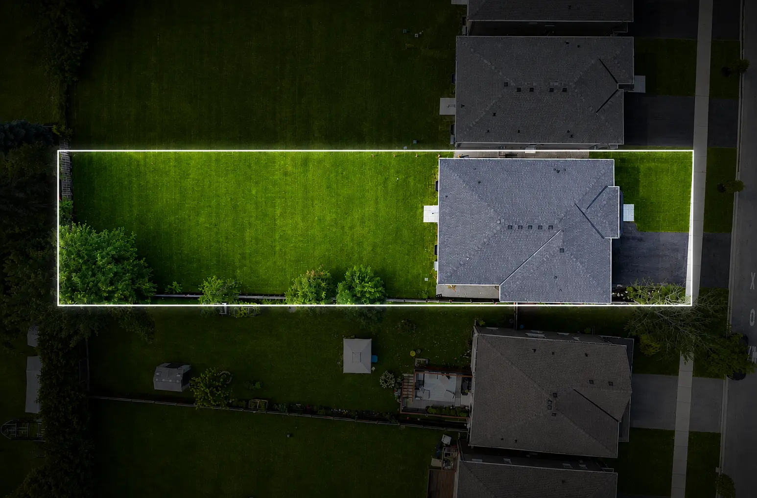 Overhead drone view outlining the 50 by 250 foot lot