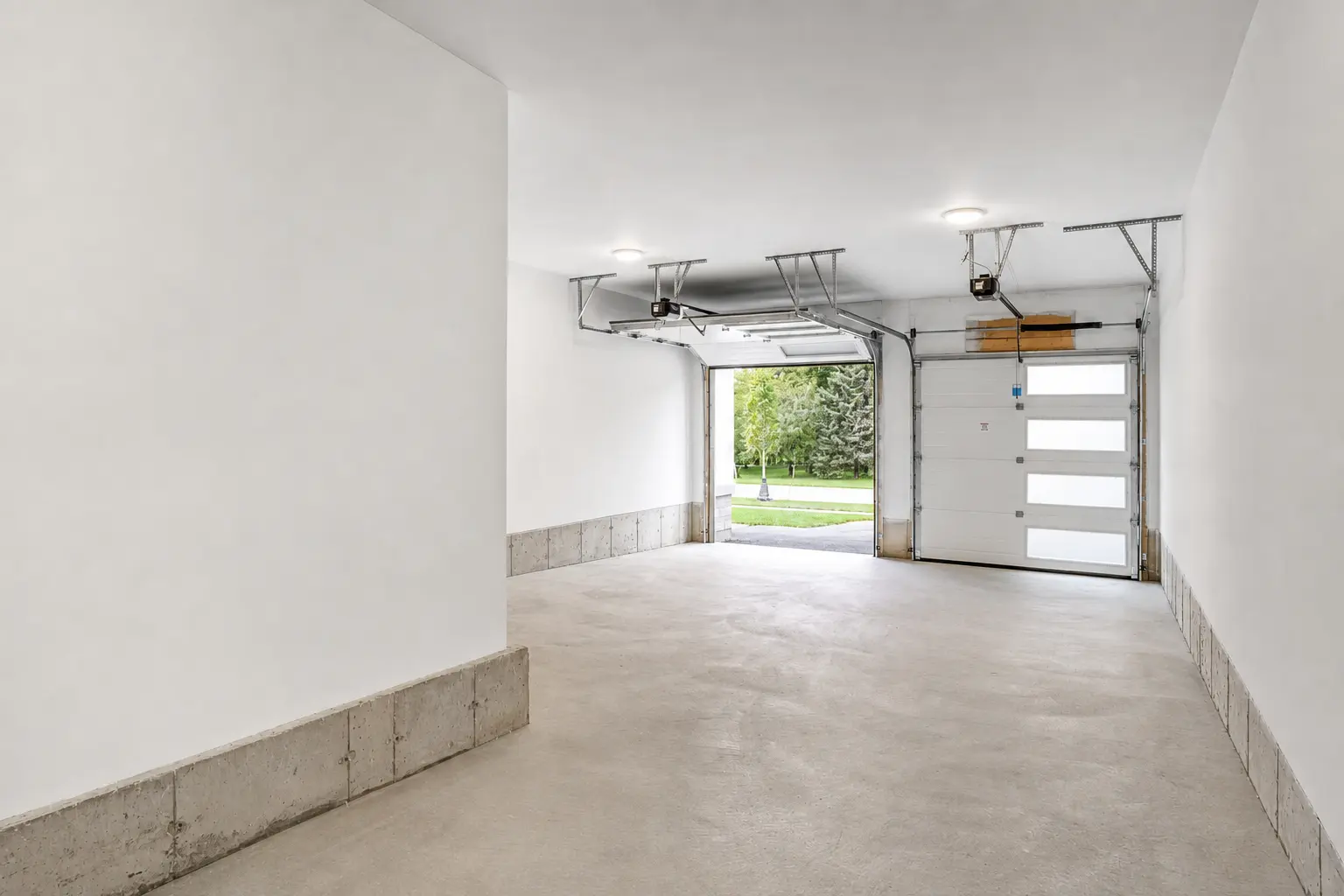 Double garage with two openers and finished walls