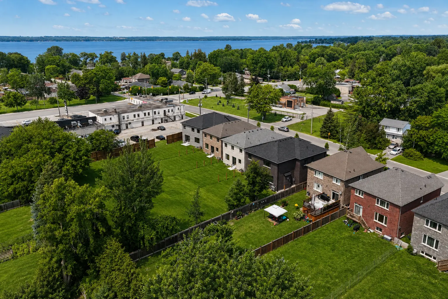 Aerial view of the deep rear yards backing onto mature trees