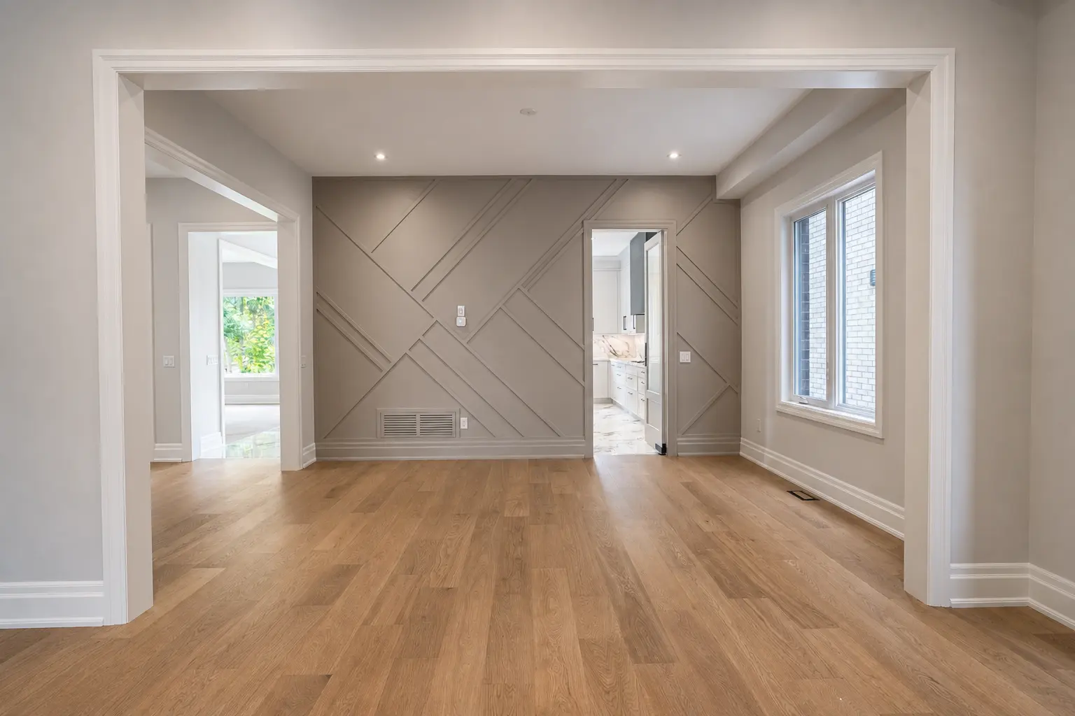 Dining room with geometric panelled feature wall and butler's pass-through